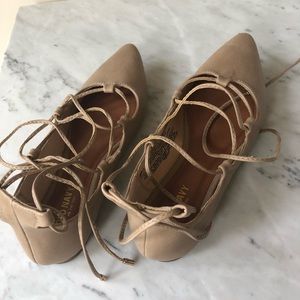 Pointed toe lace-up flats. Nude faux leather.